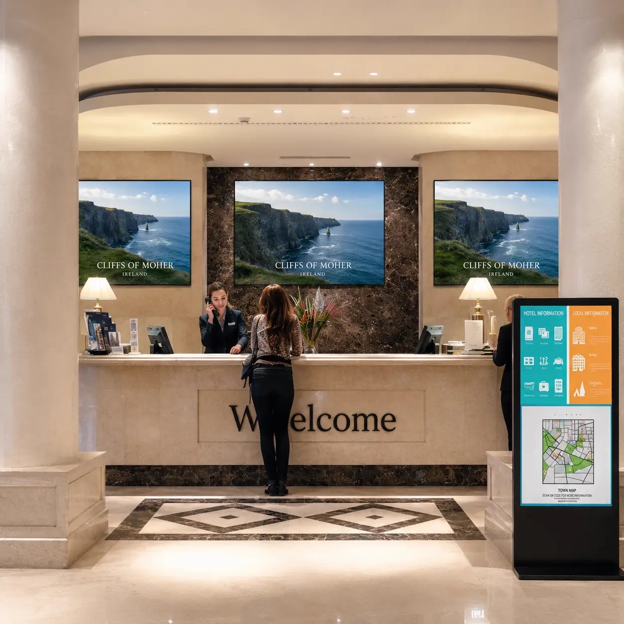 Hotel reception with digital signage screens displaying guest information and local content