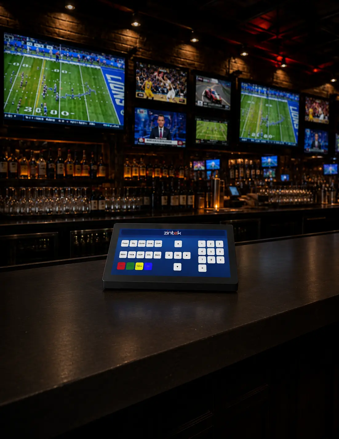 Sky Controller device on a bar counter managing multiple live sports TV screens
