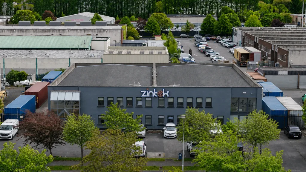 Zintek building in an industrial park surrounded by trees and business units